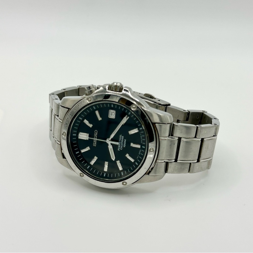 SEIKO Men’s Perpetual Calendar 100M Silver Chain Watch with Black Dial SNQ007